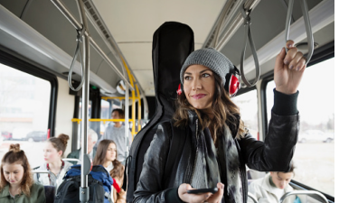 Girl With Headphones on the Bus